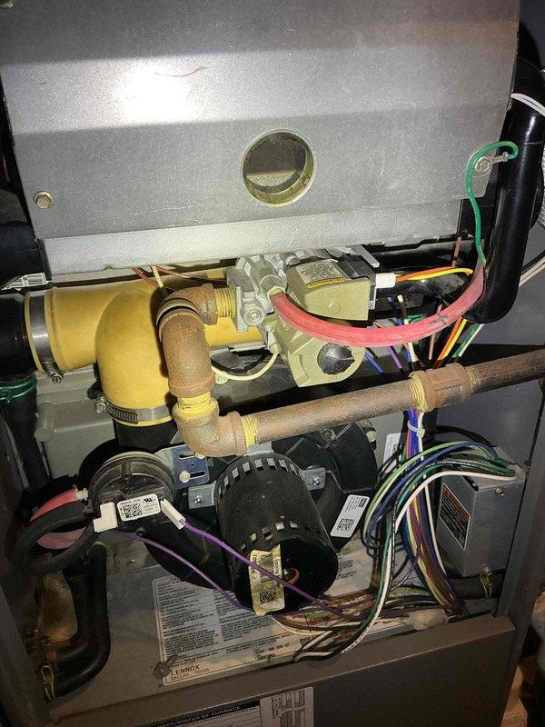 Responded to service call for water pooling under customer's older furnace. Diagnosed overflow issue with condensation pump that had tripped the GFCI. Cleaned the pump thoroughly and reset power to resolve the issue.