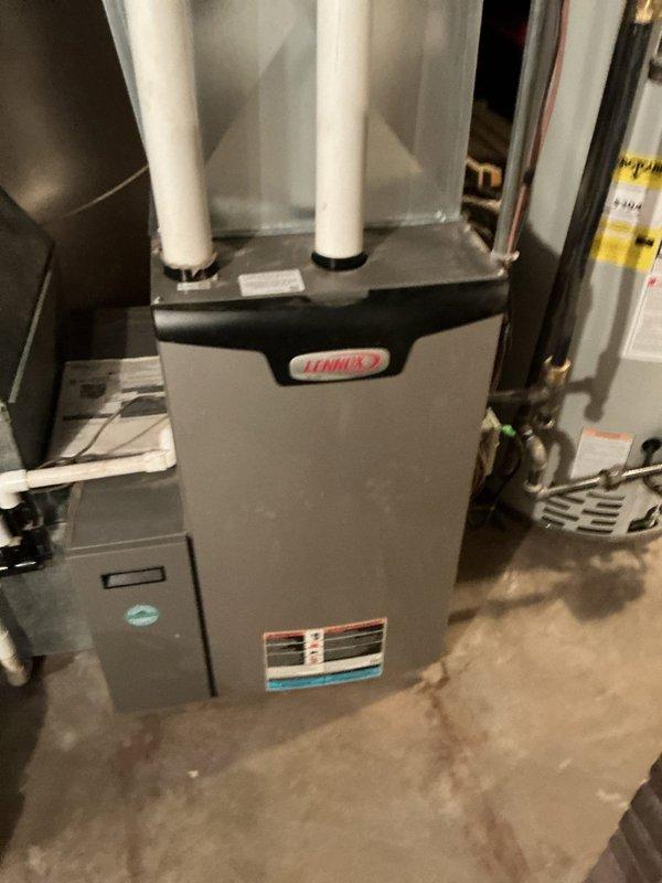Performed maintenance tune-up on 2-year-old Lennox furnace. Inspected internal components and heat exchanger. Found humidifier non-operational due to failed transformer and corroded drain. Discussed adding condensate pump with Wayne, recommended transformer replacement and humidifier replacement to restore proper system functionality.