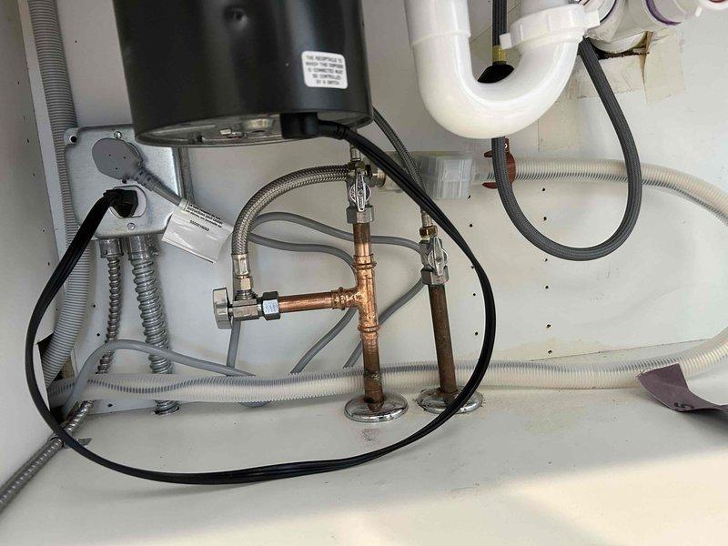 Replaced cartridges in kitchen and bathroom faucets to resolve leaks. Kitchen cartridge was installed immediately while bathroom cartridge has been placed on order. Also assessed garbage disposal connection in preparation for upcoming dishwasher installation scheduled for Friday.