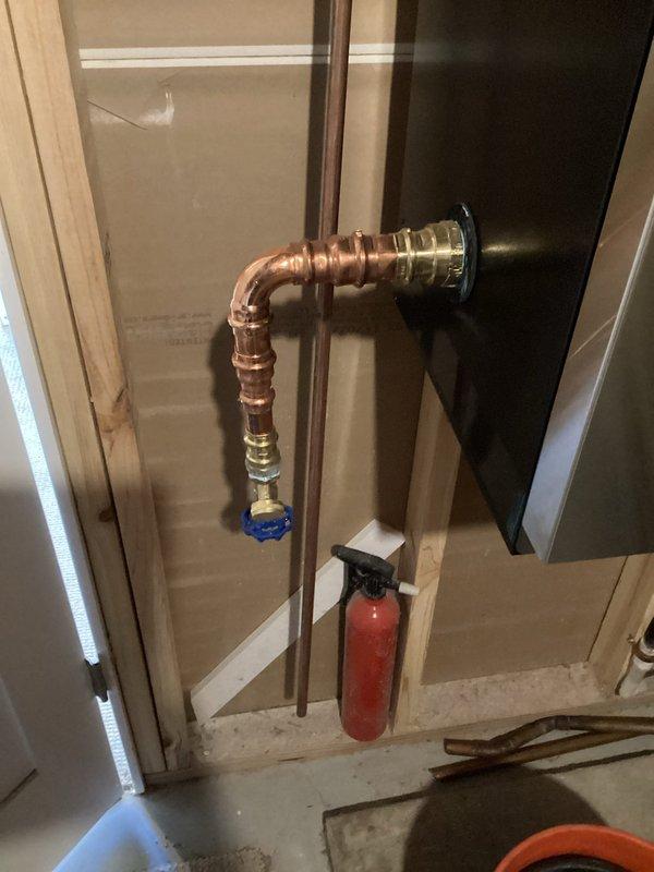 Responded to homeowner's complaint of banging noises from recently installed IBC SL199 boiler. Identified air in system as the cause, purged all loops using transfer pump, verified proper zone valve operation, and set indirect tank to high priority. Reinstalled pressure relief valve in vertical orientation to meet code requirements, resulting in normal system operation without noise issues.