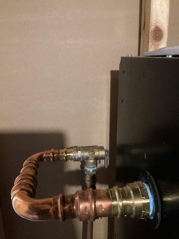 Responded to homeowner's complaint of banging noises from recently installed IBC SL199 boiler. Identified air in system as the cause, purged all loops using transfer pump, verified proper zone valve operation, and set indirect tank to high priority. Reinstalled pressure relief valve in vertical orientation to meet code requirements, resulting in normal system operation without noise issues.