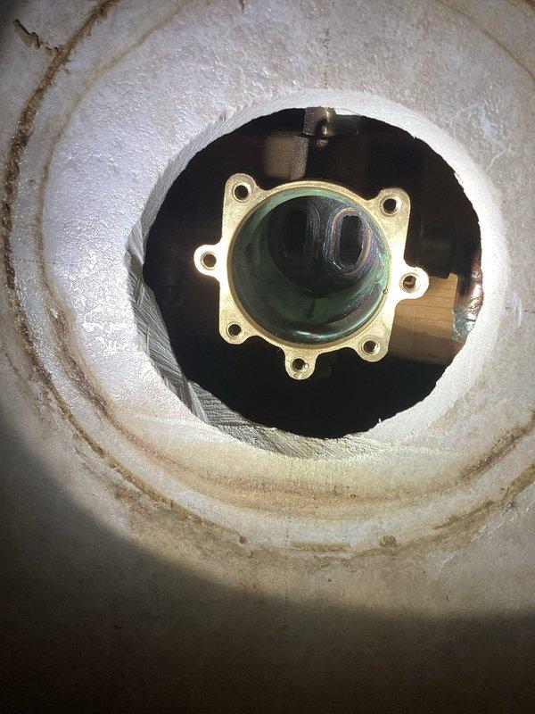 Diagnosed and replaced faulty shower cartridge within the valve body to resolve leaking issues from the shower head and diverter switch. Inspection of the exposed valve assembly revealed mineral buildup and wear requiring complete cartridge replacement rather than repair.