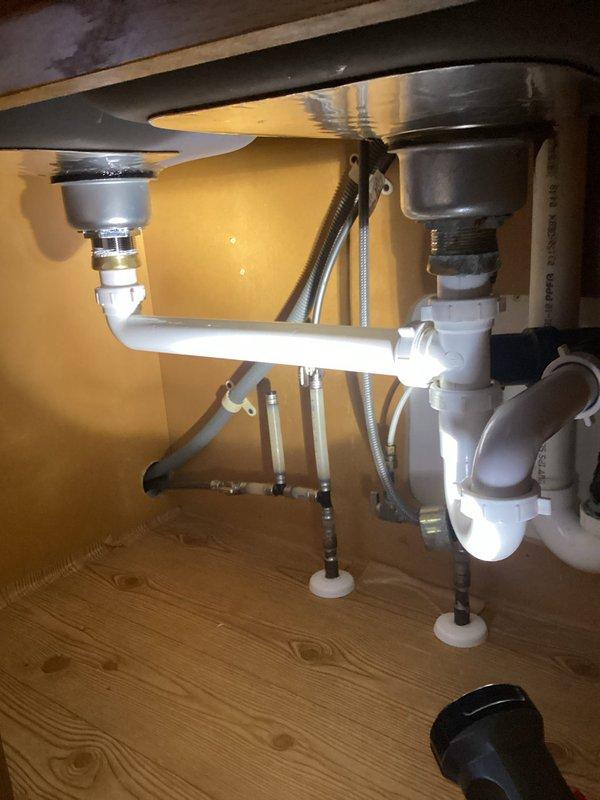 Successfully removed non-functioning garbage disposal and reconfigured plumbing to a standard drain configuration. Installed sink basket in place of the disposal unit and verified proper drainage through newly connected P-trap assembly. All connections were secured and tested for leaks prior to completion.