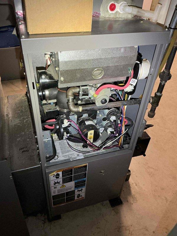 Diagnosed furnace failing to reach thermostat setpoint due to high pressure switch fault preventing second stage operation. Discovered buildup issues affecting collector box, inducer assembly, and secondary heat exchanger. Recommended replacement of affected components and provided customer with estimate for repairs.