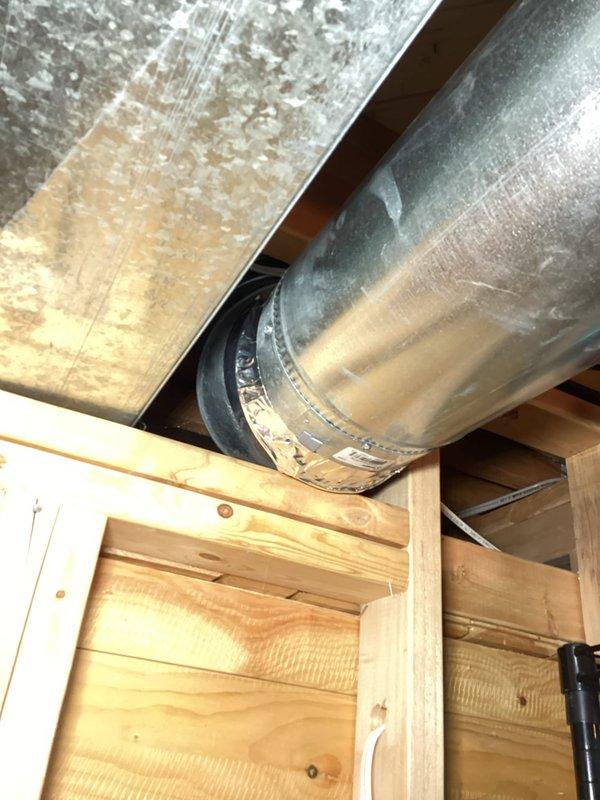 Responded to customer report of booster fan making rattling noises, causing insufficient heating in upper level of residence. Upon inspection, discovered booster fan piping was inadequately secured, with motor vibrating against floor joist in ceiling cavity. Corrective action included readjusting the motor position and installing additional securing points for the ductwork to eliminate vibration. System now operating properly with no further rattling observed.