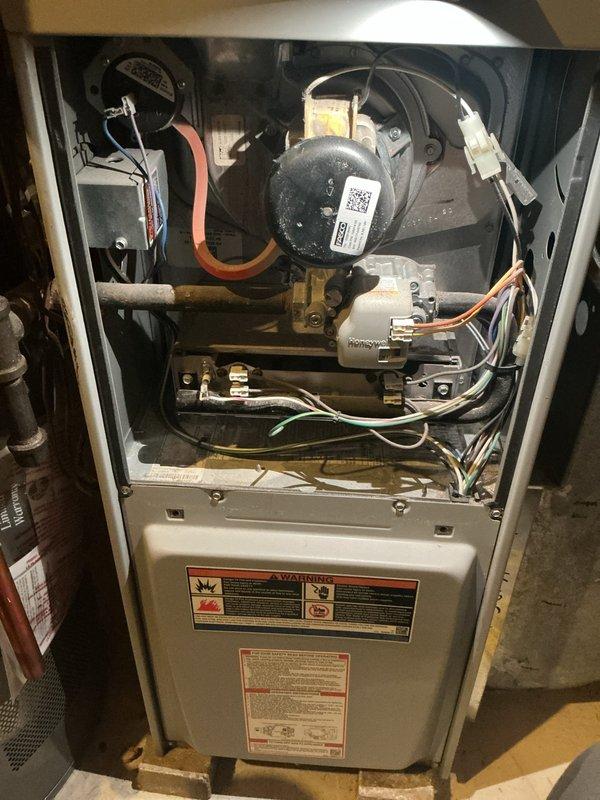 Performed comprehensive furnace inspection on 11-year-old natural gas system. Identified and replaced multiple failing components including motor starter capacitor, flame sensor (reading under 2 microamps), ignitor, and inducer draft motor (running on high amps). CO levels in flue verified safe and system is now operational.