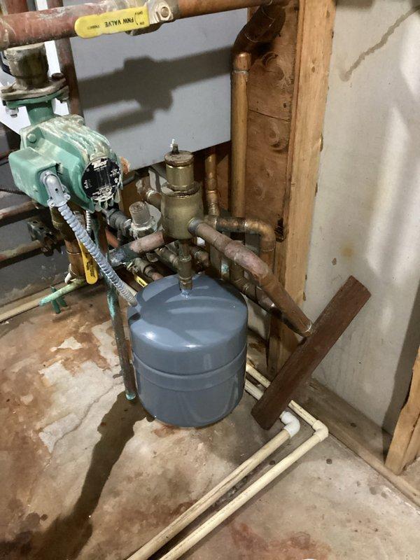 Replaced leaking expansion tank and air vent on customer's boiler system. Installed new components and verified proper operation with no leaks during startup. System now functioning correctly with normal water flow.