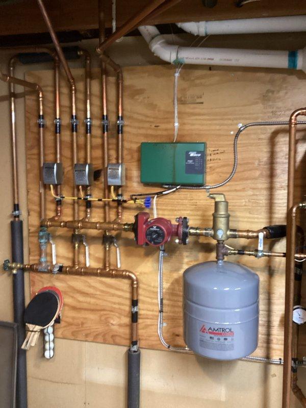 Diagnosed boiler operating abnormally with flame fluctuations and vibration noise at intake pipe. Inspection revealed damaged ignitor at spark point and internal damage to the Venturi damper section affecting airflow and causing noise. Ordered replacement parts including ignitor, flame sensor, and gas valve assembly with attached Venturi.