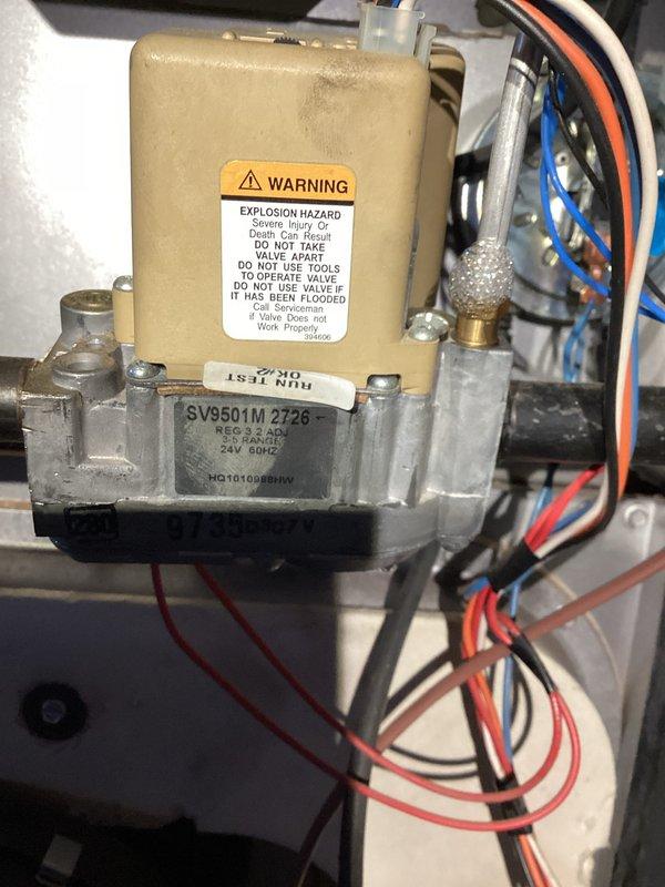 Performed tune-up on 27-year-old Heil furnace. Diagnosed vibrating noise in basement traced to condensation pump. Inspected heat exchanger and found questionable areas requiring attention. Documented condition of gas valve (SV9501M 2726) and overall system configuration for follow-up recommendations.