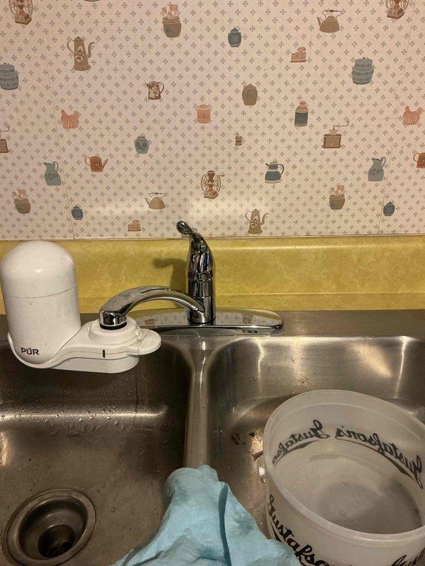 Replaced old kitchen faucet with new Moen single-handled model after meeting with customer POC (Sam). Original fixture was deteriorated and difficult to operate; successfully installed and tested new faucet functionality.