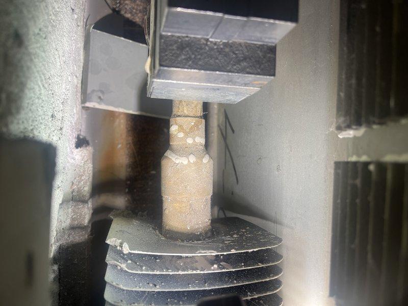 Responded to no-heat complaint in commercial building. Investigated zone valve serving Matt's office and found it stuck in closed position. Manually freed valve to restore heat flow. Noted significant mineral deposits on the aging valve (appears to be original to building) and minor dripping. Recommended eventual replacement of 5-1/3" zone valve. Submitted parts request form for future replacement estimate.