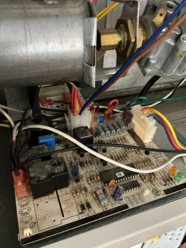 Diagnosed Reznor garage heater failure following lightning strike damage. Confirmed 120V power supply to control board but no voltage output to transformer. Replaced failed control board to restore heater functionality.