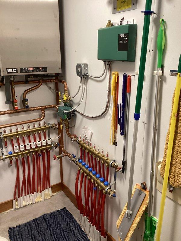 Responded to customer concern of IBC HC boiler (4 years old) randomly shutting down. Performed overdue maintenance service including thorough heat exchanger cleaning and system water replenishment to restore proper pressure. Unit was successfully tested with all zones functioning correctly and proper ignition verified. Determined that accumulated debris and low water pressure were the likely causes of the intermittent shutdowns.