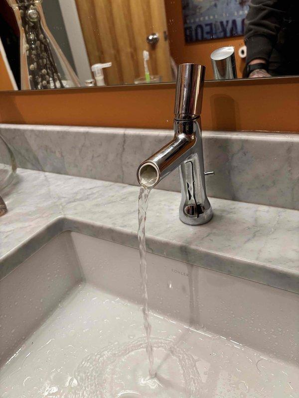 Replaced failed cartridges in two bathroom faucets to resolve issues - one handle was leaking and the second faucet had significantly reduced water flow. Both fixtures now functioning properly with normal water flow and no leakage.