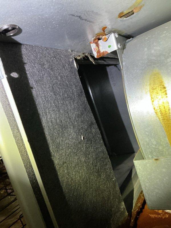 Responded to service call for 2-year-old furnace with reported water leakage. Upon inspection, discovered significant corrosion and rust on mounting brackets and metal surfaces within the unit. Diagnosed a failing secondary heat exchanger which was actively leaking. System was tagged for safety and recommended replacement of the heat exchanger.