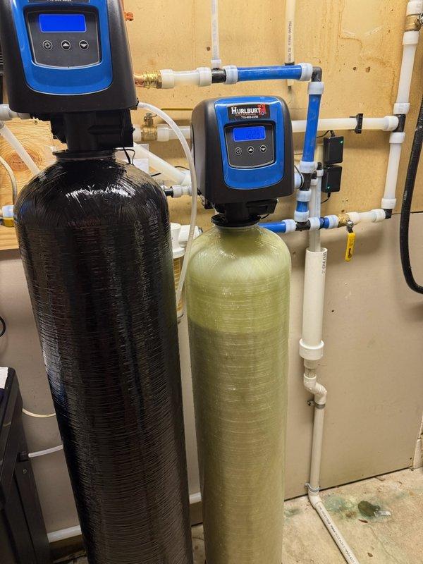 Responded to service call for acid neutralizer system installed 14 days prior that was leaking at a joint. Diagnosed issue as a cracked discharge adapter. Replaced discharge adapter on the Hurlburt water treatment system, successfully resolving the leak that had been causing water accumulation on the concrete floor near the dual-tank setup.