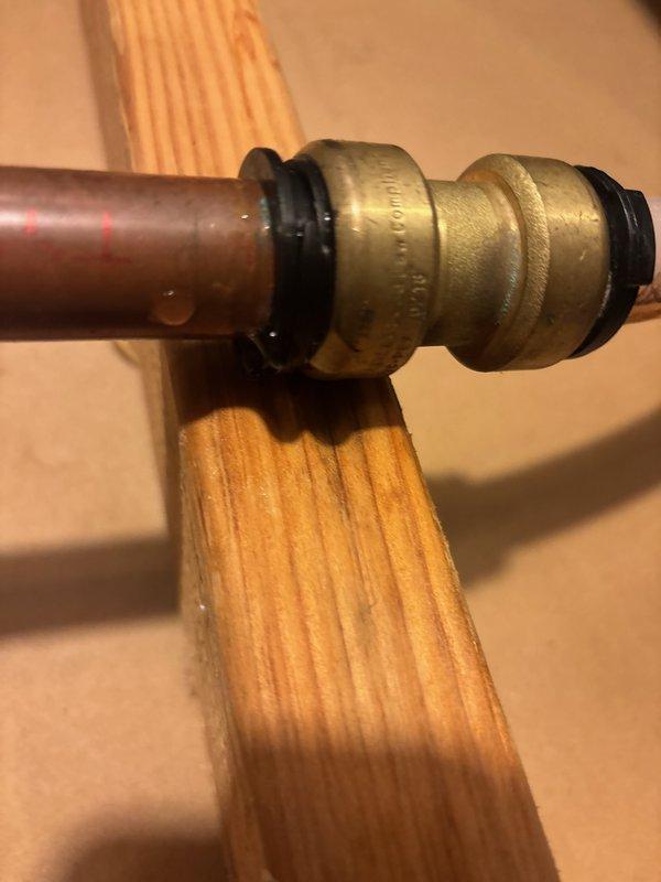 Responded to water leak emergency in mechanical room where a 3-inch section of copper pipe between two PEX lines had failed at the connection point. Water supply to the duplex was shut off prior to arrival. Removed the failed copper section and replaced with continuous PEX tubing, eliminating the vulnerable transition point that was previously spraying water onto the furnace. Restored water service to both residential units after confirming proper installation and no leaks.