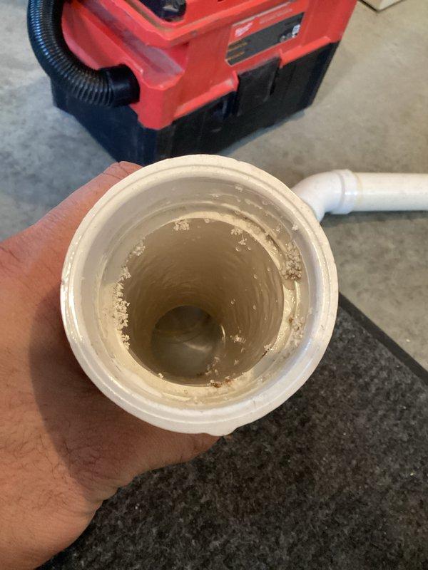 Responded to warranty service call for condensate leak. Identified wet furnace filter and rust residue caused by improperly pitched chimney creating backflow. Performed necessary rework on chimney components to correct drainage issue and ensure proper condensate flow.