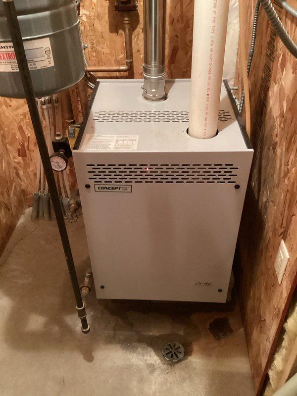 Responded to service call for 24-year-old boiler with unusual odor. Diagnostic inspection revealed rough ignition and multiple system leaks. Performed complete service including replacement of automatic air vent and pressure relief valve, cleaned burner assembly to improve combustion, and bled air from system. Unit was tested and monitored for proper operation for approximately 20 minutes after repairs to ensure safe, efficient functioning.