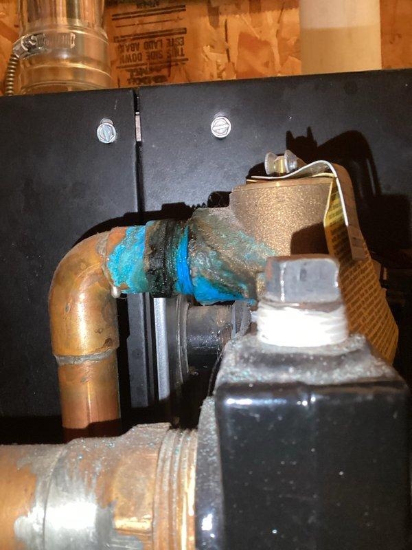 Responded to service call for 24-year-old boiler with unusual odor. Diagnostic inspection revealed rough ignition and multiple system leaks. Performed complete service including replacement of automatic air vent and pressure relief valve, cleaned burner assembly to improve combustion, and bled air from system. Unit was tested and monitored for proper operation for approximately 20 minutes after repairs to ensure safe, efficient functioning.