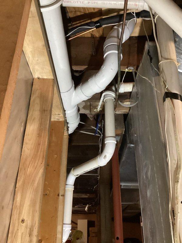 Completed replacement of 4" cast iron main stack for powder bathroom with PVC piping. Service included removal of deteriorated cast iron piping from main stack to floor level at toilet and main vent/lavatory drain. Successfully installed new PVC drainage system throughout the affected area, secured within structural framework, and reset existing toilet to complete the repair.