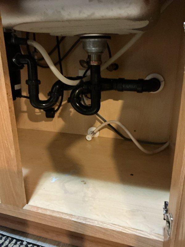 Successfully installed customer-supplied kitchen faucet with pulldown sprayer in double-basin sink, completing proper connection to supply lines and drain assembly. Also installed two additional bathroom faucets and replaced two showerheads as requested, ensuring all fixtures were properly sealed and functioning correctly before departure.