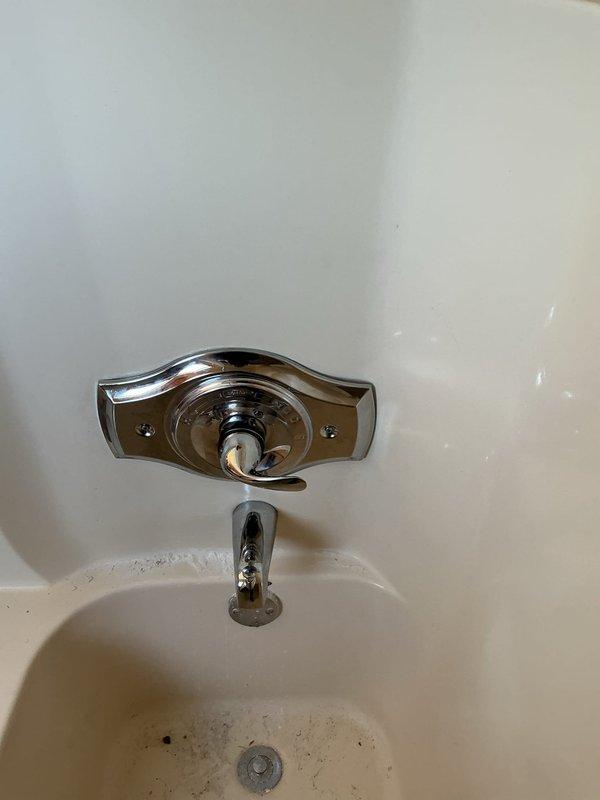 Completed installation of a Moen T2133/2520 Brushed Nickel tub shower valve, spout and shower head. Removed existing shower valve components and replaced with new system featuring LifeShine® finish and lever handle control. Verified proper operation after installation.