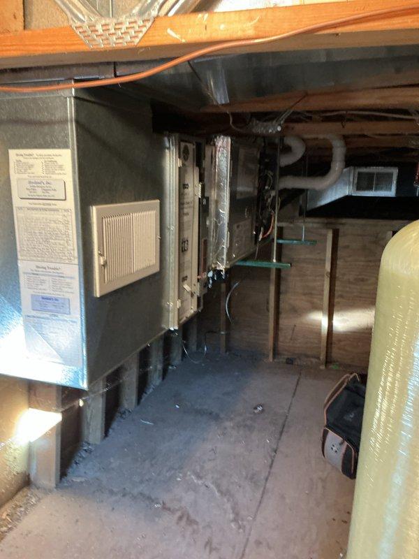 Performed annual maintenance on 1-year-old furnace located in crawl space beneath deck. Replaced dirty 16x25x5 filter and humidifier pad during service. System functioning properly with no operational issues detected.