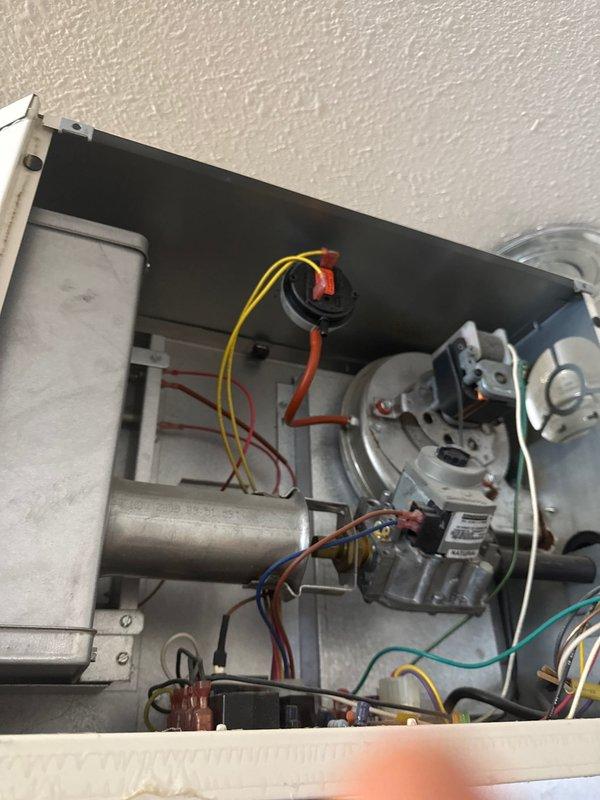 Responded to service call for 10-year-old Reznor garage heater with no heat issue. Diagnosed faulty gas valve preventing ignition despite blower operation. Replaced gas valve and confirmed proper system function with successful ignition cycle and heat production.