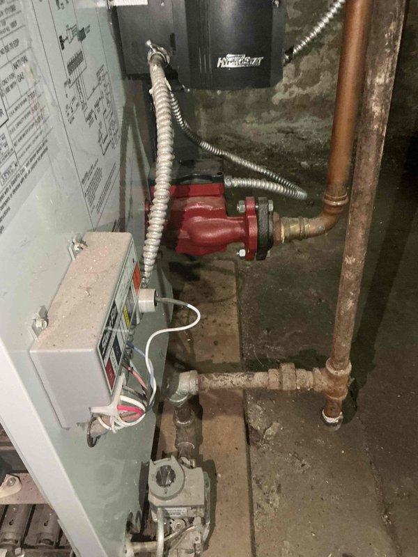 Diagnosed 15-year-old Slant Fin boiler with no heat issue. Determined gas valve failure - pilot light functioning properly but main burners not igniting despite verified 25V power supply to both ignition module and valve. Currently sourcing replacement part for repair completion.