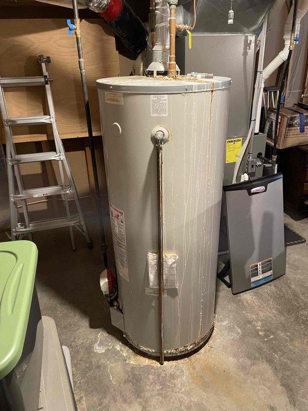 Completed furnace preventative maintenance on 5-year-old FRP system. All components operating within specifications; replaced customer-supplied air filter. Identified water heater actively leaking, causing chimney blockage and combustion rollout issues. Advised customer immediate water heater replacement is required and provided estimate options per their request.