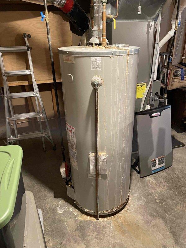 Completed furnace preventative maintenance on 5-year-old FRP system. All components operating within specifications; replaced customer-supplied air filter. Identified water heater actively leaking, causing chimney blockage and combustion rollout issues. Advised customer immediate water heater replacement is required and provided estimate options per their request.