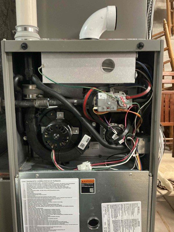 Responded to warranty call for 2-year-old Lennox furnace displaying error code 270 (no flame current sensed). Inspected grounds, removed and cleaned flame sensor, then tested to confirm strong reading. System now operating correctly with all components in good condition. Recommended annual pre-season maintenance to clean flame sensor and prevent similar issues.