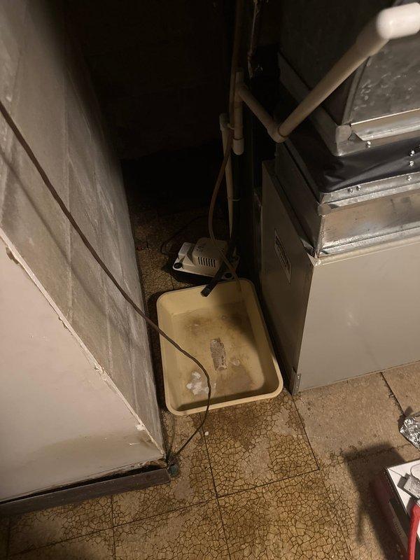 Responded to emergency call for basement flooding caused by failed condensate pump. Replaced defective pump with new unit from inventory. Identified broken humidifier damper as secondary issue which was causing continuous humidifier operation and contributing to excessive water accumulation in basement.