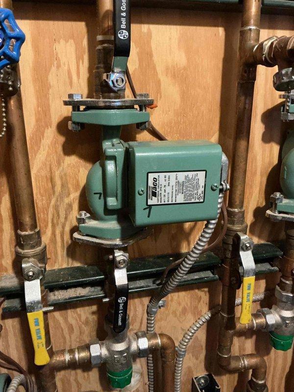Responded to client's report of partial heat issue with boiler system that serves in-floor radiant heating. Inspected the zoned hydronic system with multiple Taco circulators mounted on plywood backing, verifying thermostat function for two problematic zones. Confirmed both thermostats properly engage their respective pumps and that supply/return lines feel warm when called. Due to complexity of the multi-zone installation with numerous valves and copper distribution piping, scheduled follow-up visit with senior technician for further diagnosis as immediate cause of inadequate heating in upstairs bedrooms could not be determined.