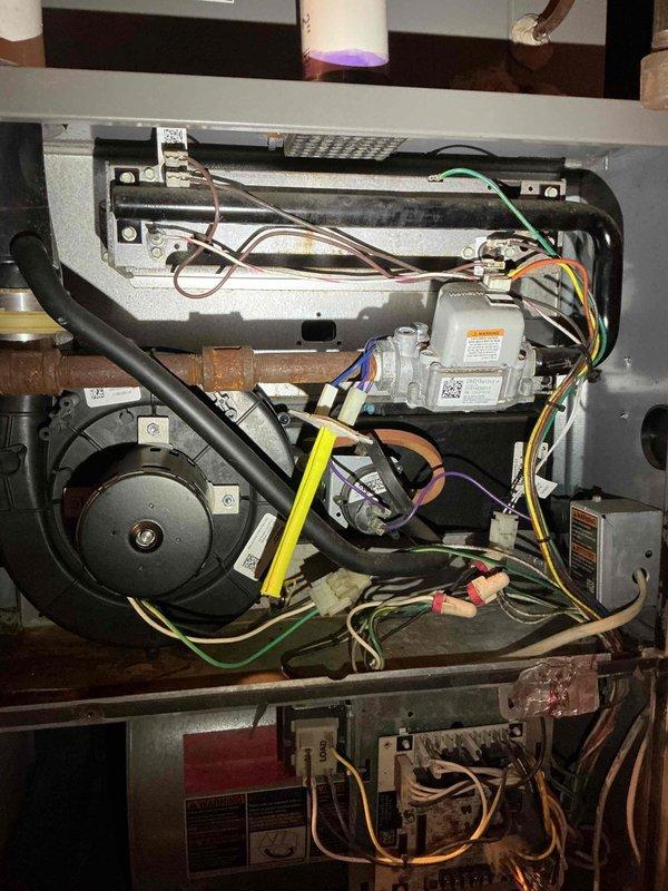 Diagnosed a no heat condition on 13-year-old Lennox furnace that was repeatedly tripping on high limit due to severely restricted airflow from completely plugged filter caused by portable humidifier dust. Replaced filter, restored proper airflow, and furnace stopped limiting out. Visual inspection of heat exchanger revealed heavy heat damage and burners displaying dancing/flashing orange patterns during blower operation, indicating possible heat exchanger breach; scheduled service advisor follow-up for further evaluation.