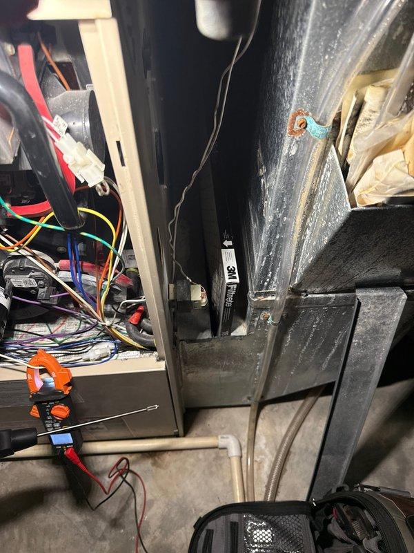 Performed annual maintenance service on 21-year-old furnace. System is operating safely with properly functioning ignitor, flame sensor, and solid electrical connections. Filter has approximately one month of serviceable life remaining; though unit is aging, it is currently functioning adequately.