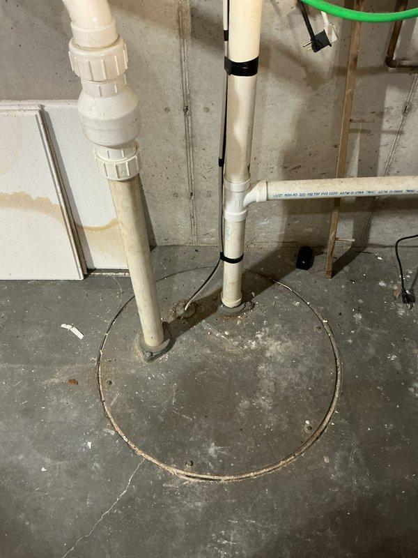 Responded to service call for failed lift pump on main drain near furnace. Diagnosed sewer pump in basement not working due to float mechanism being obstructed by accumulated solids. Performed thorough cleaning of the tank to remove debris and manually rotated pump to ensure proper operation and prevent future hang-ups.