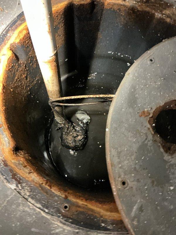 Responded to service call for failed lift pump on main drain near furnace. Diagnosed sewer pump in basement not working due to float mechanism being obstructed by accumulated solids. Performed thorough cleaning of the tank to remove debris and manually rotated pump to ensure proper operation and prevent future hang-ups.