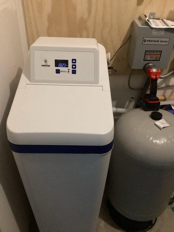Inspected Morton water softener system and Pentair water treatment setup in response to customer concerns about water hardness. Performed diagnostics on the water softener control system and confirmed unit is operating properly, contradicting previous assessment from another service provider. No repairs needed as all equipment was found to be functioning within normal parameters.