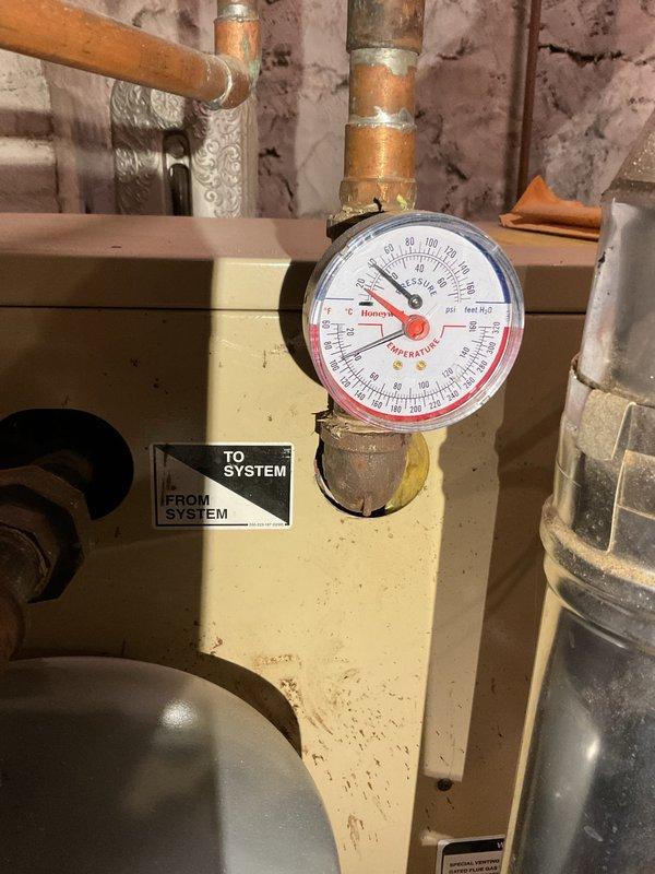 Performed annual tune-up on 2003 high-efficiency boiler which is in generally good condition. Inspection revealed system requires new HSI, lacks proper air elimination, and has an inaccurate pressure/temperature gauge. Recommended complete radiator system flush, drain and treatment along with installation of missing components to bring system to proper specifications.