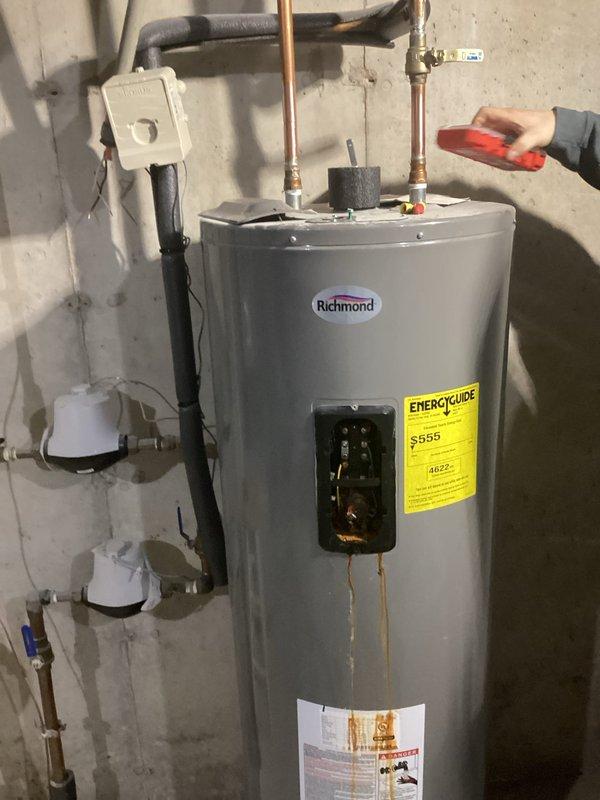 Replaced failed 50-gallon Richmond electric water heater exhibiting burning smell and leakage. Installed new Bradford White 50-gallon electric water heater with proper connections to existing plumbing and electrical systems, restoring hot water functionality to residence.
