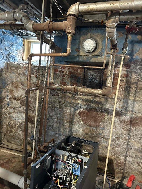 Responded to no-heat service call for a McClain boiler system, less than 2 years old, that was cycling on and off intermittently. Diagnostic inspection revealed gas ignition failure. Identified faulty components covered under manufacturer warranty and submitted estimate to customer for replacement parts.