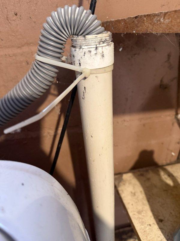 Responded to service call for active washing machine drain leak. Discovered galvanized plumbing was plugged, shut-off valves were non-functional, and tub drain required repair. Completed full replacement of galvanized piping with new PVC drainage system, installed new shut-off valves, and replaced tub drain to restore proper functionality.