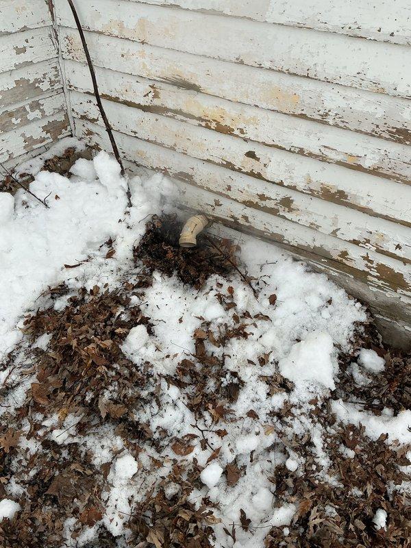 Diagnosed issue with 50-gallon natural gas power vent water heater shutting off repeatedly. Inspection revealed exterior exhaust termination was blocked by snow and leaf debris. Cleared obstruction from vent, restored proper ventilation, and confirmed unit firing and operating normally.