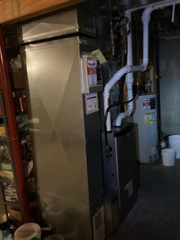 Responded to customer concern that recently installed furnace was not maintaining adequate heat. Upon inspection, discovered partially closed dampers in living room vents and thermostat set to "comfort" mode causing more frequent cycling. Opened dampers in living room vents and educated homeowner on thermostat comfort settings. Activated fan to improve air circulation throughout home to address customer's temperature perception issues. All equipment functioning properly with no mechanical deficiencies identified.