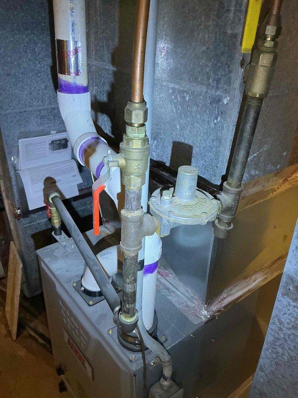 Responded to customer complaint of gas odor near regulator of recently installed furnace. Upon inspection, determined the regulator was properly venting as designed - this is normal operation, not a gas leak. Verified system safety and explained normal regulator function to customer.