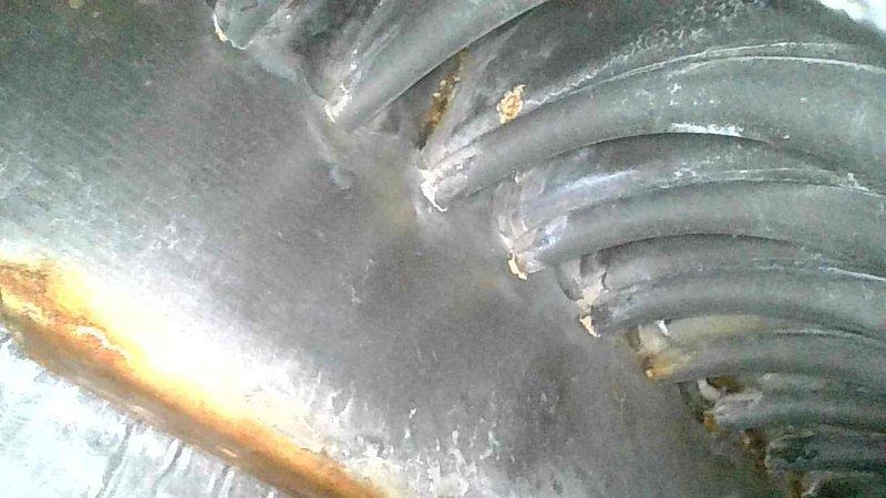 Responded to no-heat complaint for a 15-year-old forced air furnace. Diagnostic inspection revealed broken inducer wheel and developing pin holes in the secondary heat exchanger, indicating critical safety issues. Due to compromised heat exchanger integrity, furnace was tagged out of service and temporary heaters were provided until replacement can be arranged through service advisor.