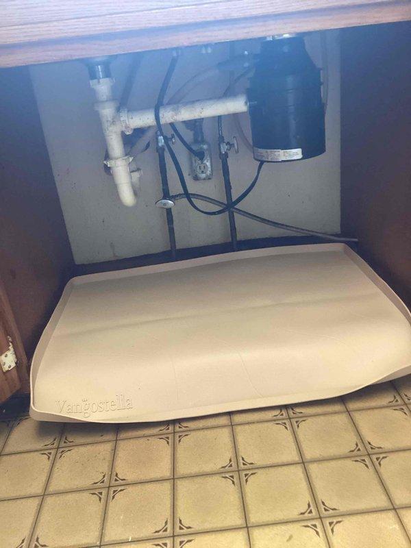 Responded to service call for leaking kitchen faucet. Diagnosed severe corrosion on fixture, particularly on valve body which displayed extensive oxidation and blue-green patina. Completed temporary repair of the faucet, but advised customer that replacement is recommended due to age and deteriorated condition of the unit and associated components.