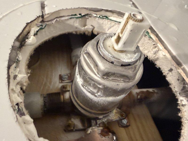 Inspected shower valve system accessed through master bedroom closet. Confirmed valve leakage and source of water intrusion. Provided estimate for replacement of existing valve with customer-supplied chrome fixture.